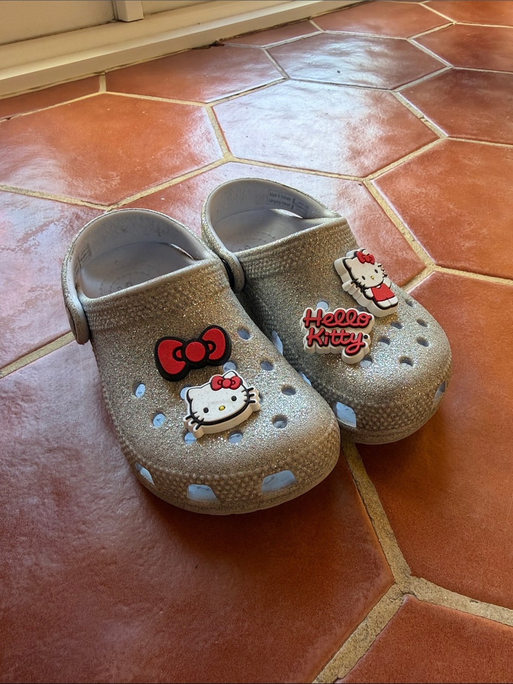 Hello Kitty Glitter crocs in Silver with Red Accents